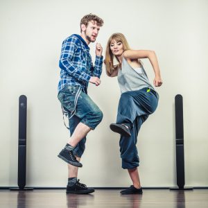 Two modern dancers couple woman and man dancing. Urban lifestyle. Hip-hop generation.